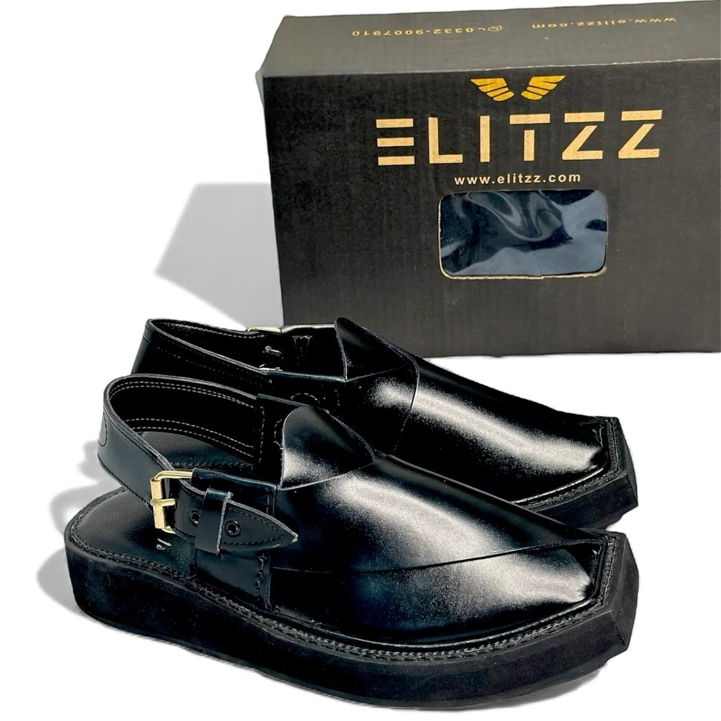 Elitzz black leather formal khussa shoes with gold buckle and thick sole in front of branded box